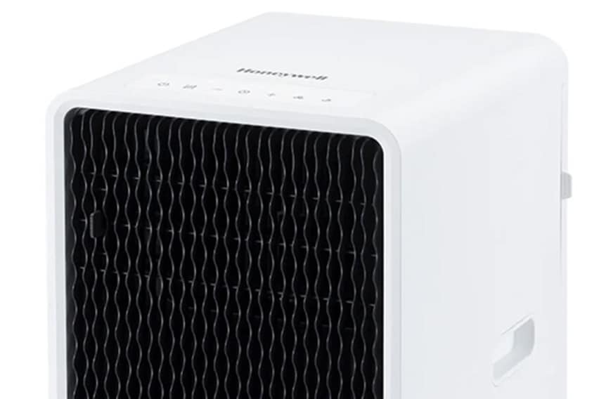 Honeywell portable air conditioner featuring a distinctive black wave-pattern grille, white housing, integrated controls and castor wheels.